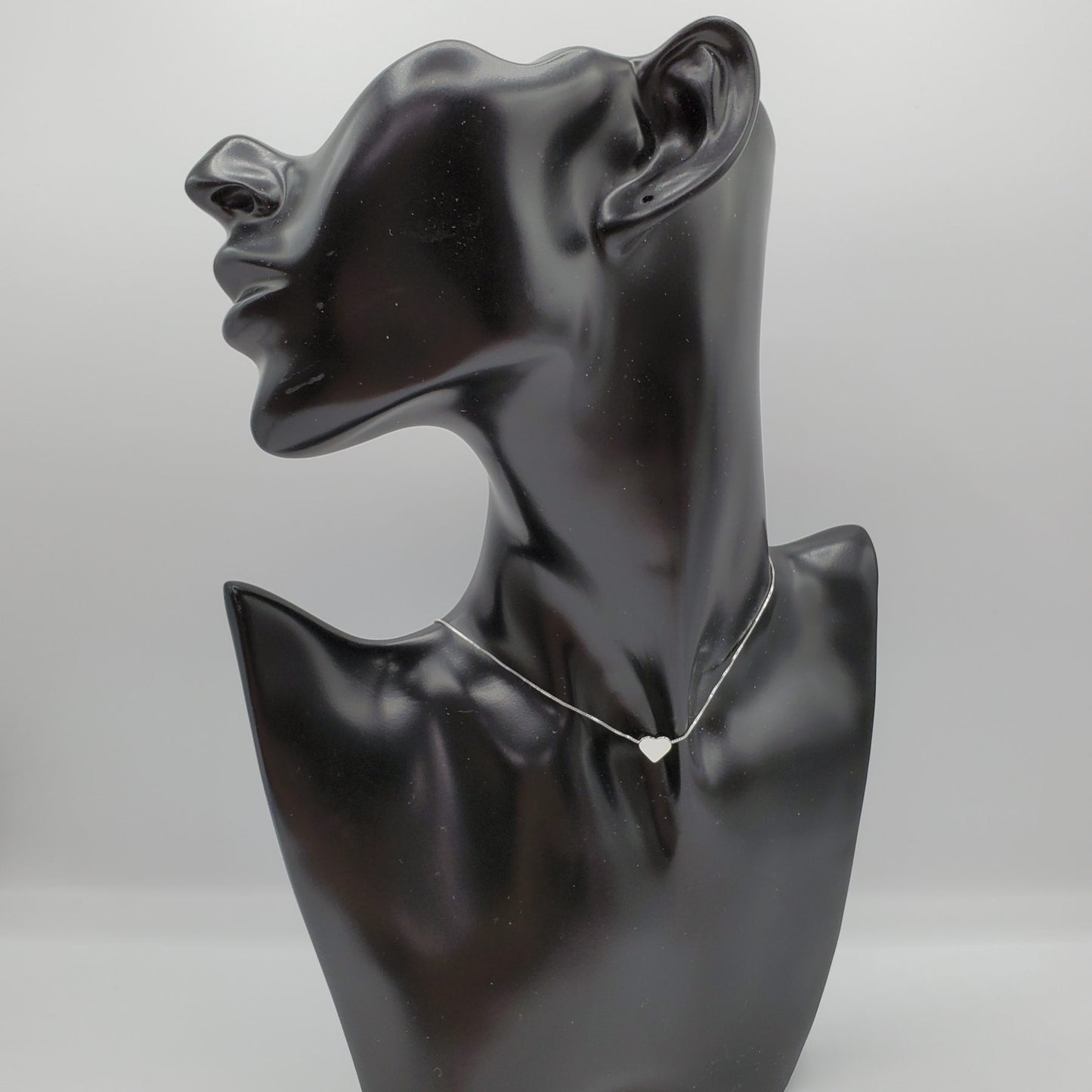 Delicate .925 sterling silver necklace with a  2mm silver floating heart