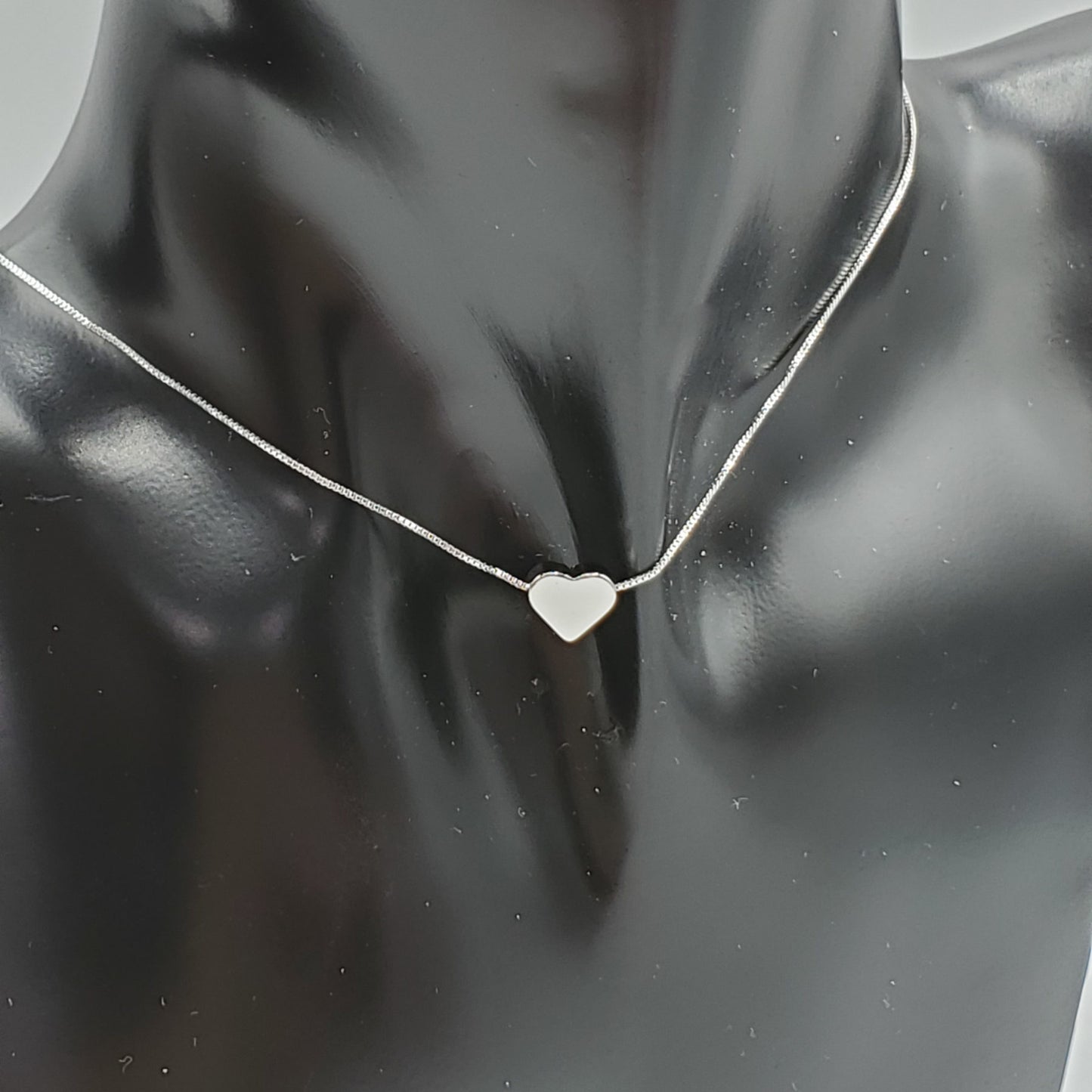 Delicate .925 sterling silver necklace with a  2mm silver floating heart