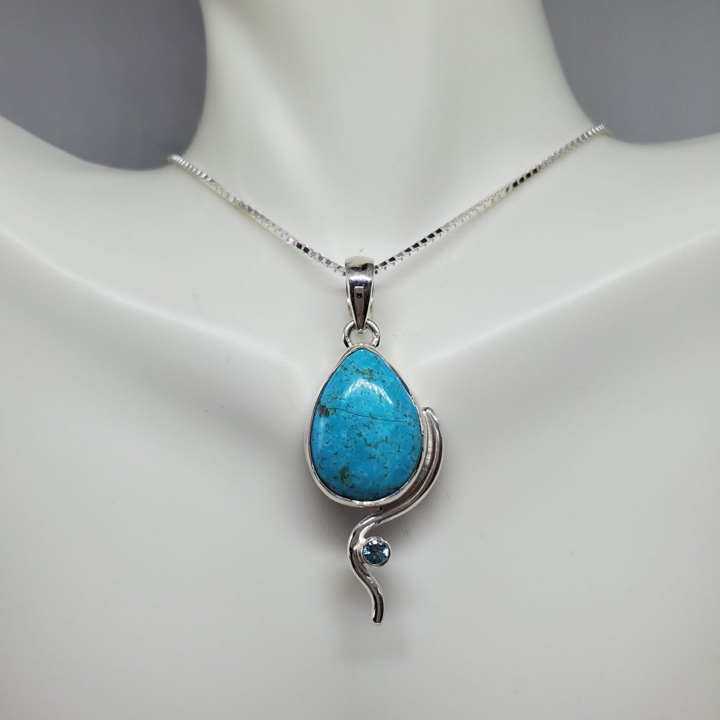 Turquoise Pendant accented by Blue Topaz