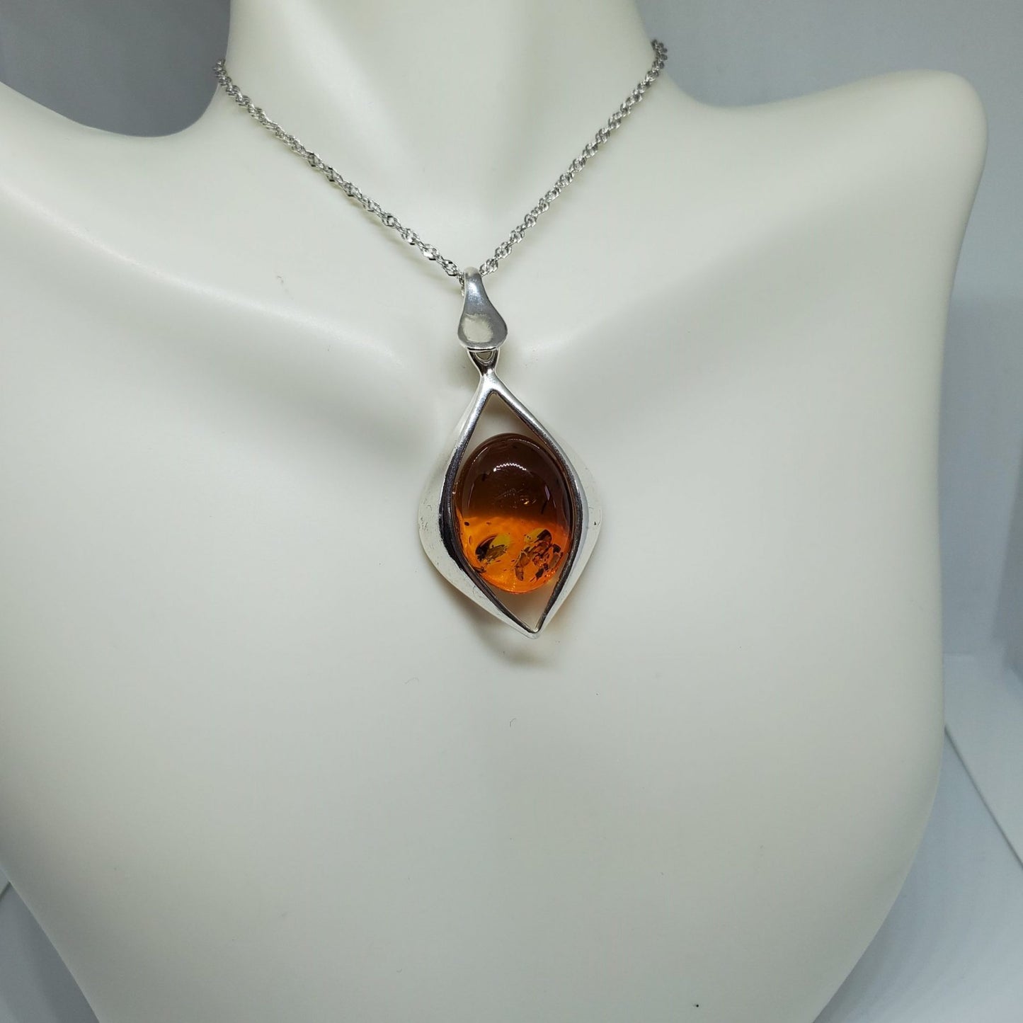 Honey Amber Oval Pendant with Silver Diamond Design