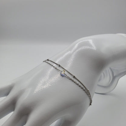 Minimalist floating crystal cube on a double chain bracelet