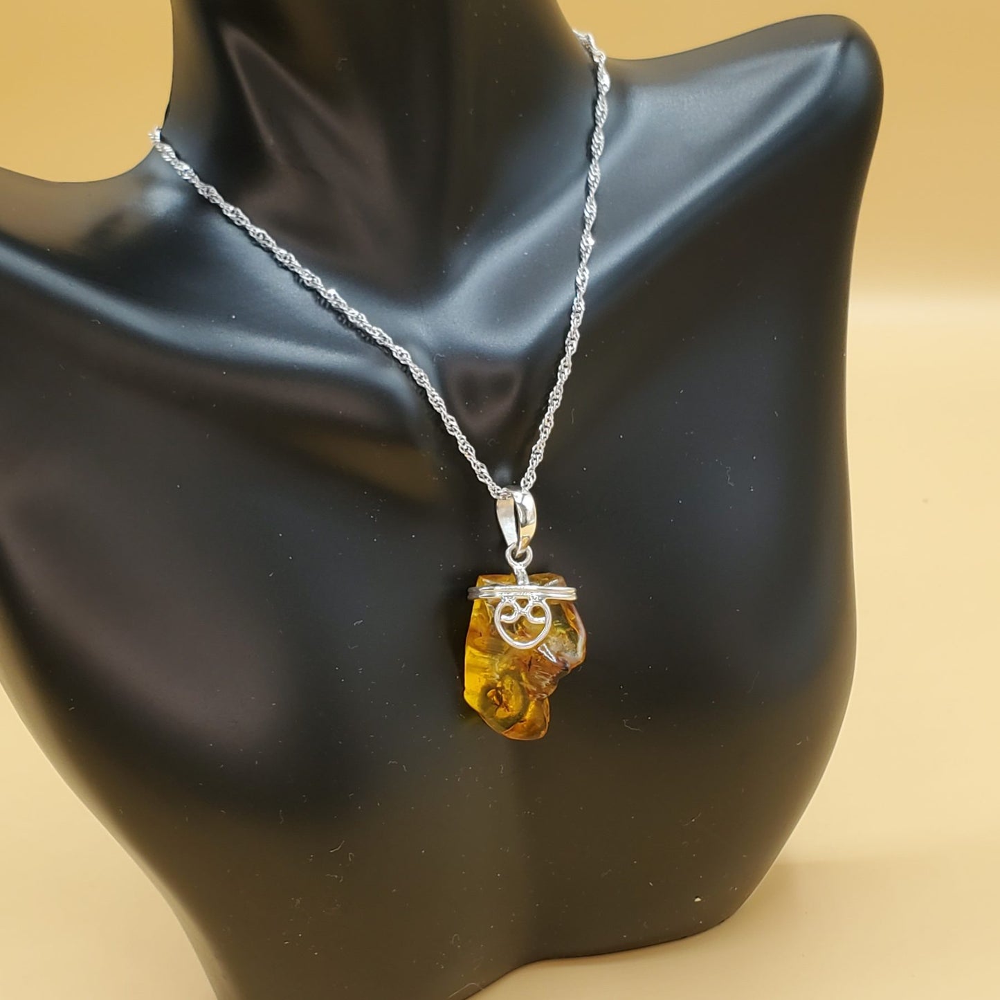 Yellow Amber Pendant Accented with Sterling Silver Filigree Heart Design