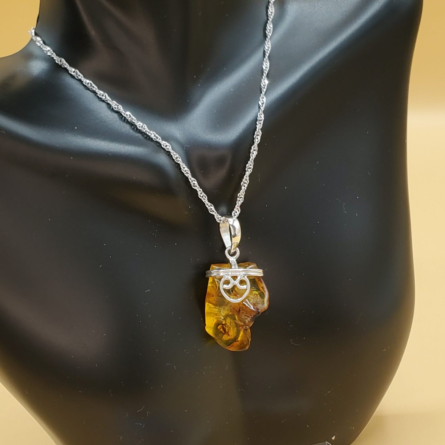 Yellow Amber Pendant Accented with Sterling Silver Filigree Heart Design