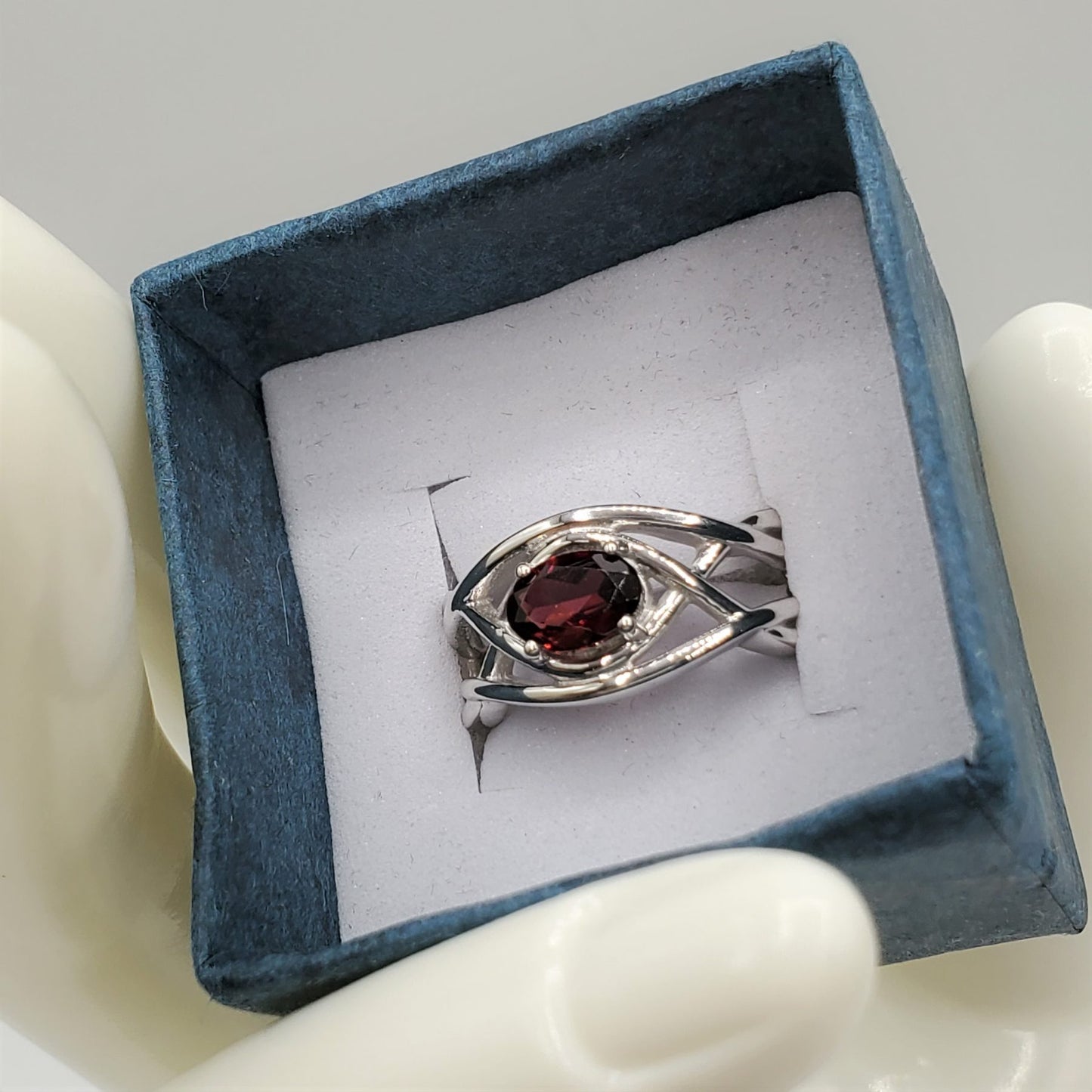 Garnet Ring with a 7.5mm oval cut center stone