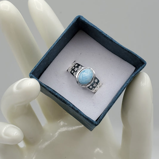 Larimar ring with an oval cut cabochon