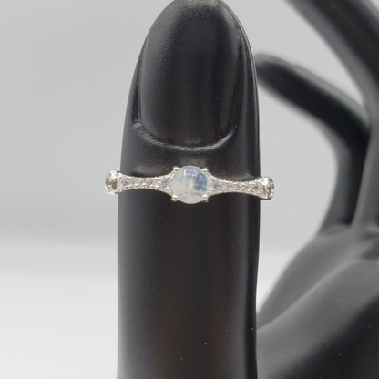 Delicate Moonstone ring with crystal accent stones.