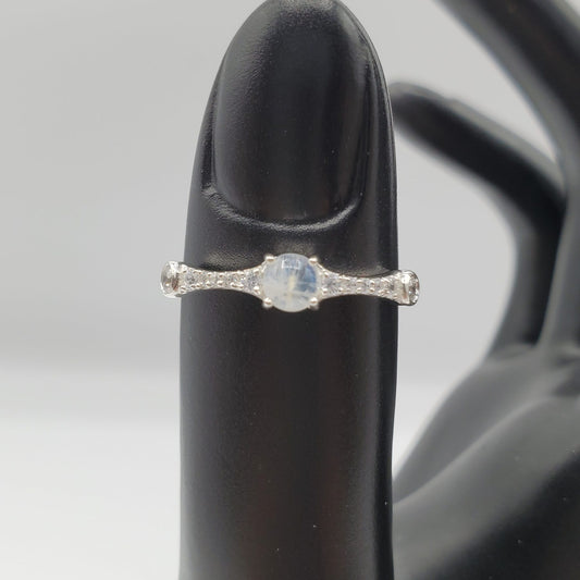 Delicate Moonstone ring with crystal accent stones.