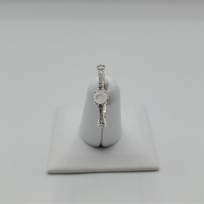 Delicate Moonstone ring with crystal accent stones.