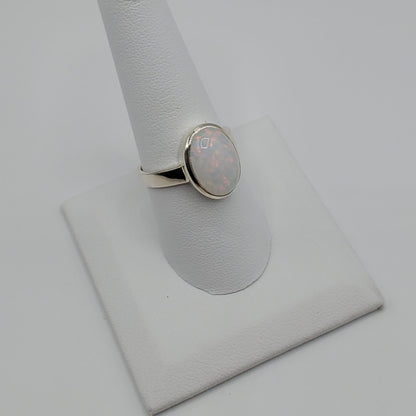 Sparkling Opal cabochon set in .925 Sterling Silver band.