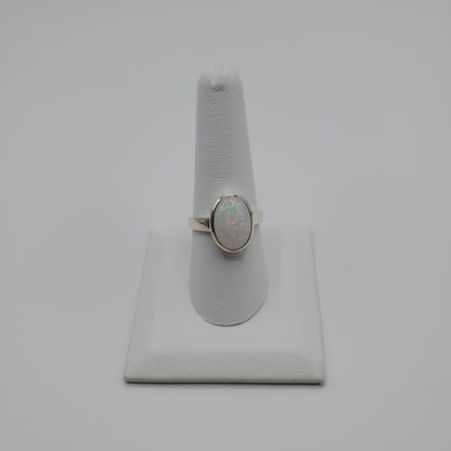 Sparkling Opal cabochon set in .925 Sterling Silver band.