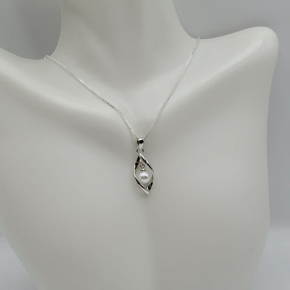 Boho Style 18" Pearl Necklace set in a twisted cage of .925 Sterling Silver