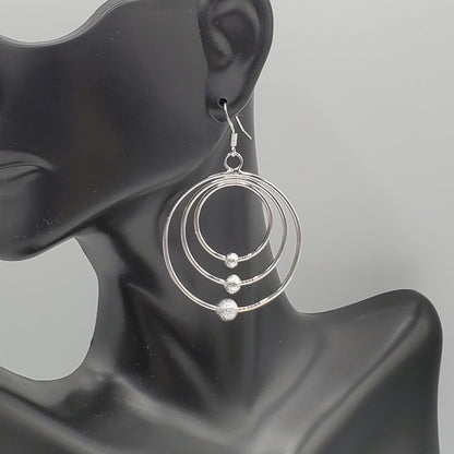 .925 Sterling Silver Graduated Circle Scrub Bead Dangle Earrings.