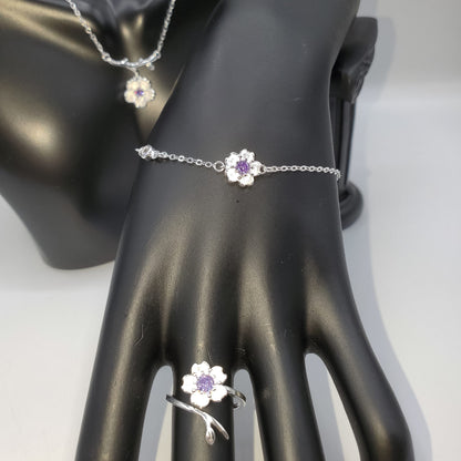 .925 Sterling Silver Jewelry Set of Cherry Blossoms accented by a center stone of amethyst.