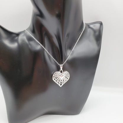 Filigree heart pendant on a 18" sterling silver chain.