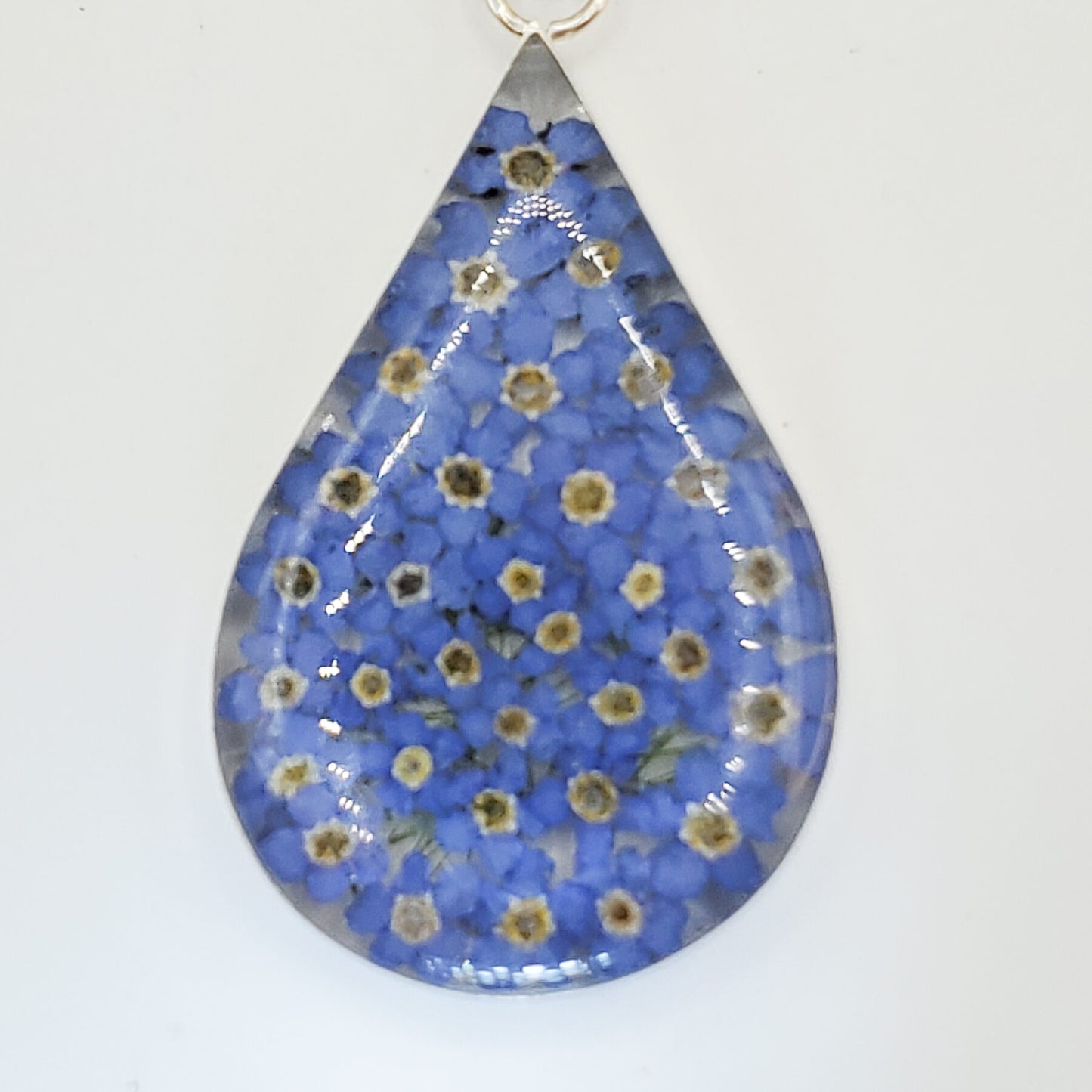 Resin pendant with delicate bluebell flowers