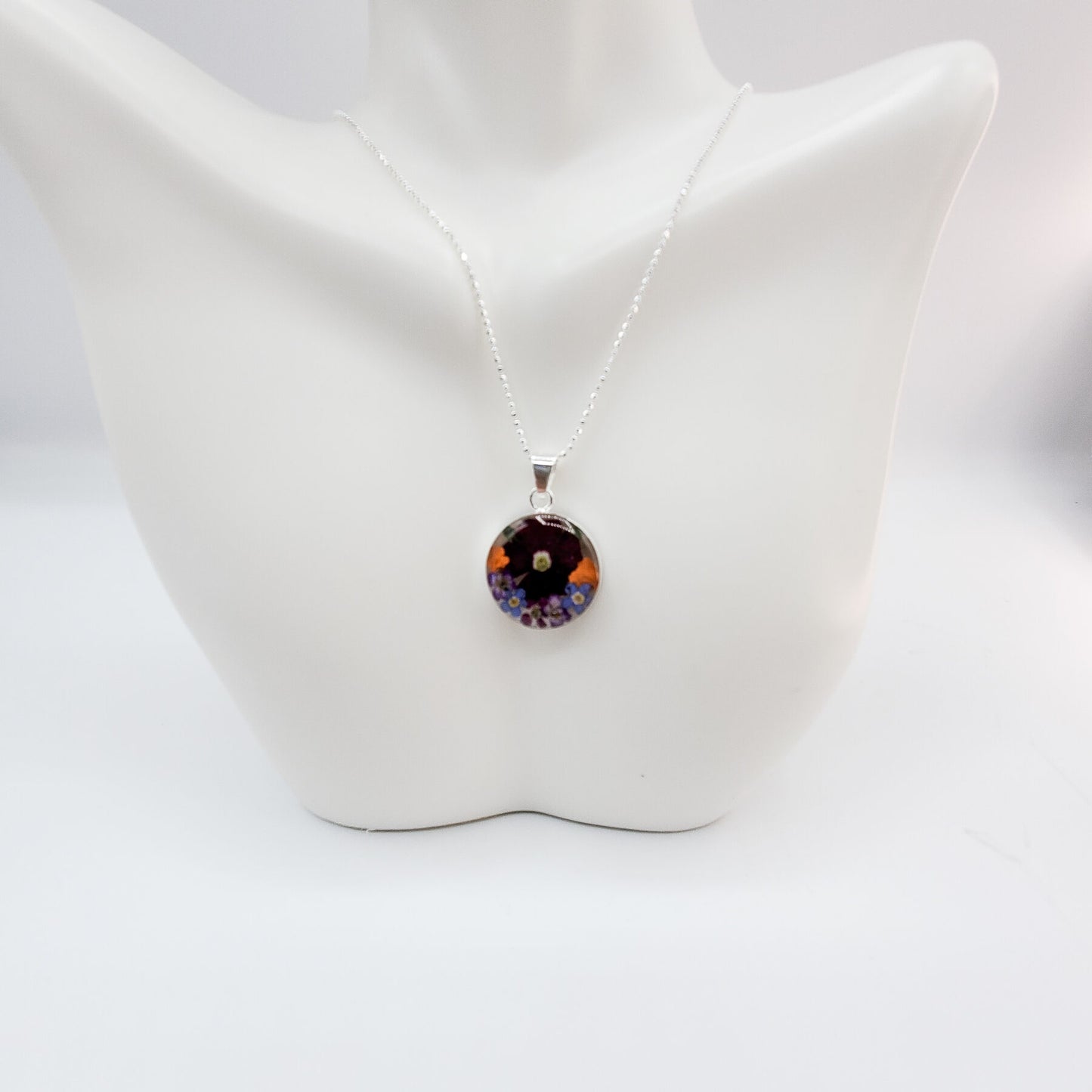 Resin pendant with large burgundy daisy