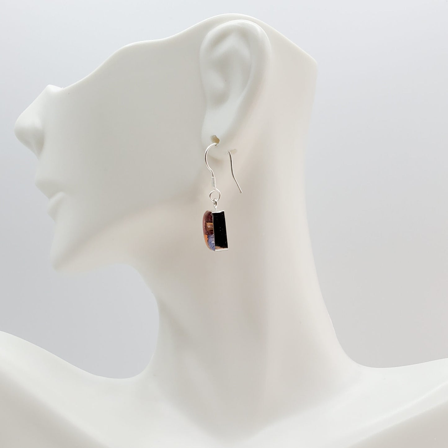 Square dangle earrings with multi colored flowers.