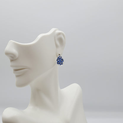 Oval blue bonnet flower stud earrings.