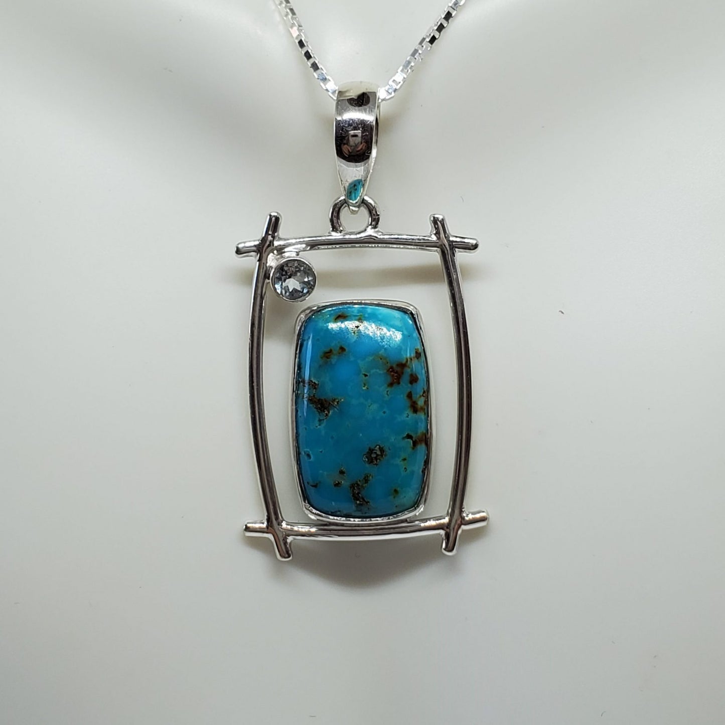 Shattuckite Pendant accented with Light Blue Topaz