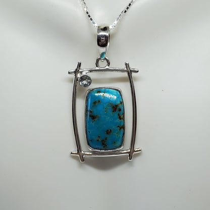 Shattuckite Pendant accented with Light Blue Topaz