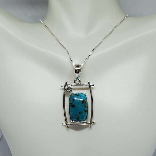 Shattuckite Pendant accented with Light Blue Topaz