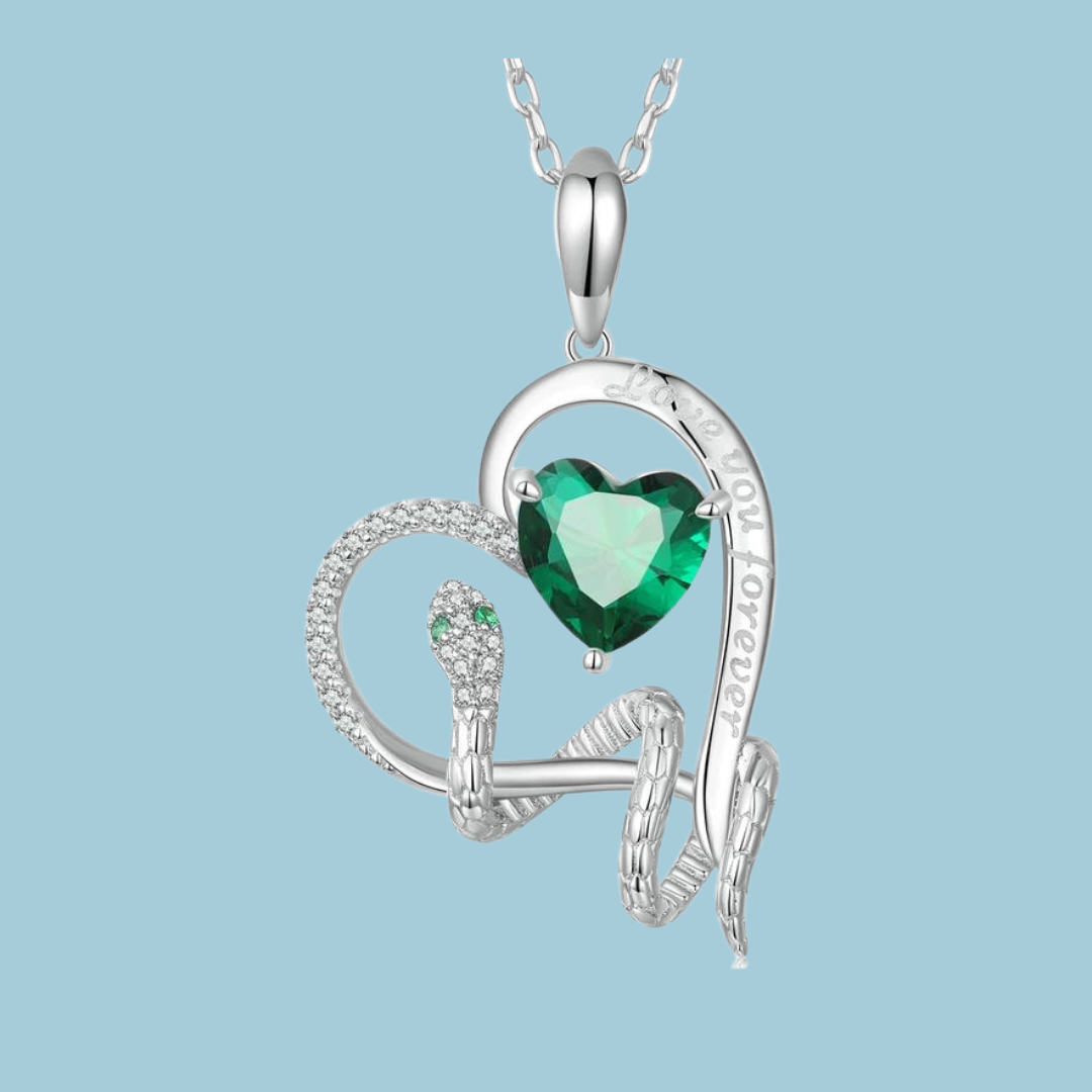 Floating heart pendant with an emerald heart shaped stone